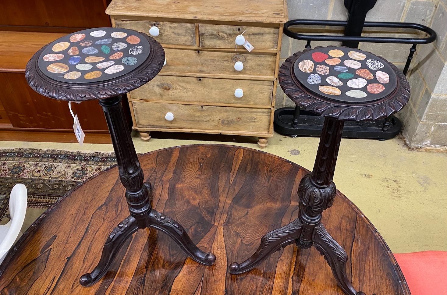 A near pair of Victorian style tripod tables with circular specimen marble tops, larger diameter 30cm, height 74cm